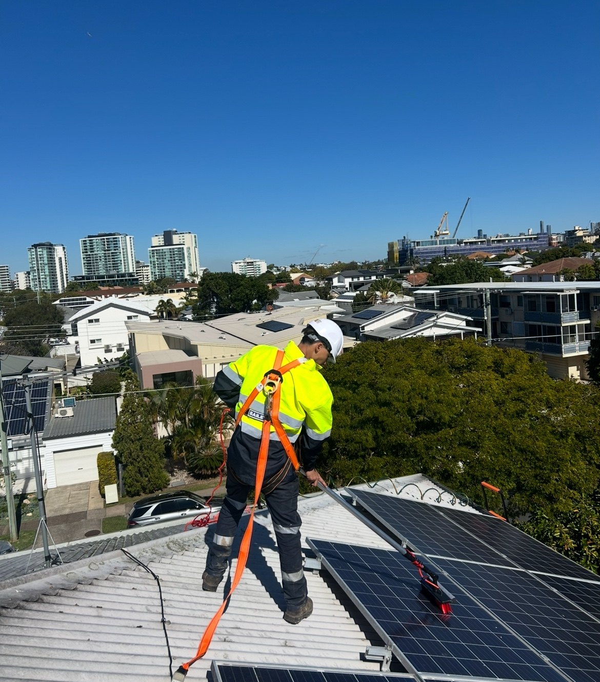 Bright Panels technician cleaning solar panels